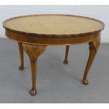 Walnut occasional table, the ova pie crust top on carved cabriole legs, 44 x 70cm