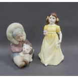 Lladro figure of a boy with a polar bear cub and a Royal Doulton figure Flowers For You, tallest