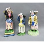 Three 19th century Scottish pottery Newhaven style fishwives, each modelled standing with a basket