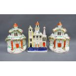 Staffordshire clock tower castle flatback and a pair of two story pottery houses, tallest 20cm (3)