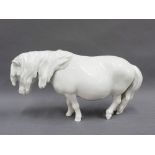 Meissen white glazed Shetland Pony, with blue crossed sword marks and impressed No. 78795, 23cm long