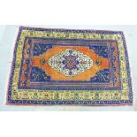 Turkish rug, the rust field with a central medallion with sapphire blue spandrels and borders, 30
