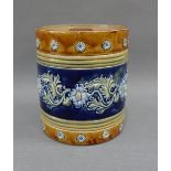 Royal Doulton pottery jar and cover with art nouveau flowers on a blue ground, with impressed