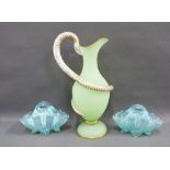 Pair of blue vaseline glass posy baskets and an opaque green glass ewer with gilded serpent handle (