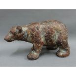 Faux stoneware, resin figure of a polar bear, 22cm long