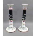Pair of Minton candlesticks, with black and white flowers, impressed date cipher and No. D2286, 31cm
