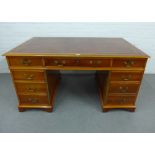 Yewwood pedestal desk with brown leather skivver and arrangement of nine drawers, 80 x 152cm