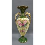 Large twin handle vase with gilded handled to side and roses pattern 41cm high