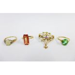 Three 9ct gold gemset rings and an unmarked gold openwork brooch with seed pearls and amethyst, (4)