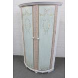 Floor standing corner cupboard, with handpainted floral swag pattern, the pink interior with a shelf