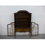 Walnut Queen Anne style bookcase cabinet, with arched top and adjustable shelves, above two drawers,