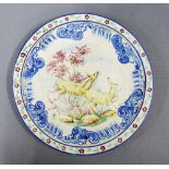 Portuguese pottery wall charger painted with deer within a blue border with flowers, signed verso,