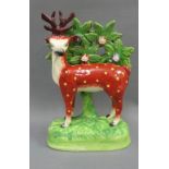 19th century Staffordshire red deer and boacage pottery figure, 20cm high
