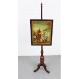 Mahogany pole screen with a glazed wool work tapestry panel and on tripod legs, 171cm