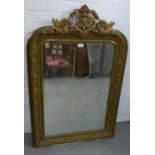 Gilt framed mirror with mythical beast cresting to top, 120 x 77cm