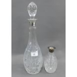 Cut glass decanter and stopper with a Birmingham silver collar, 41cm high, together with another