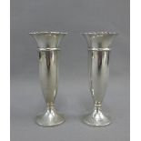 A pair of George V silver vases, Birmingham 1926, with crimped rim and circular foot, (weighted)