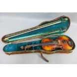 Violin with paper label inscribed after Jacobus Stainer together with two bows and contained