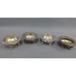 Set of four 19th century silver plate on copper salts, two with circular clear glass liners, on