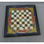 Painted glass chess board, ebonised frame, 57 x 57cm