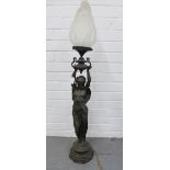 Bronze patinated spelter figural table lamp with opaque glass flame shaped shade, 105cm overall