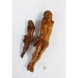 Flemish carved fruitwood figure of Christ and another of smaller size, longest 29cm (2)