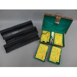 Leather cased Mahjong set and set of four ebonised tile trays, (a lot)