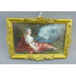 Handpainted porcelain plaque of a recumbent female in 18th century costume, in a rectangular gilt