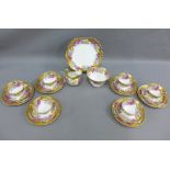 English porcelain teaset with handpainted flowers and gilt borders, 12 place setting (40)