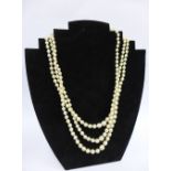 Cultured pearl triple strand necklace with silver clasp, stamped 925