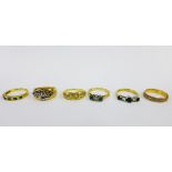 A collection of six 18ct gold rings to include a five stone diamond ring, three emerald and