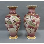 Pair of Japanese earthenware baluster vases with frilled rims and painted with figures to a plum
