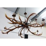 Large faux stag antler ten light chandelier with resin electric candle arms , approx 130cm (a/f)