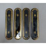 Four ebonised and gilt edged door finger plates, 28cm long (4)