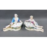 Pair of Meissen male and female figures, each modelled recumbent with a floral patterned salt, one