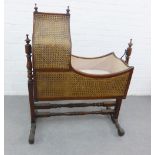 19th century mahognay and canework crib, on turned legs with rocking action, 124 x 104cm