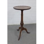 Mahogany pedestal wine table with circular top and beaded edge, on a ring turned column and spayed