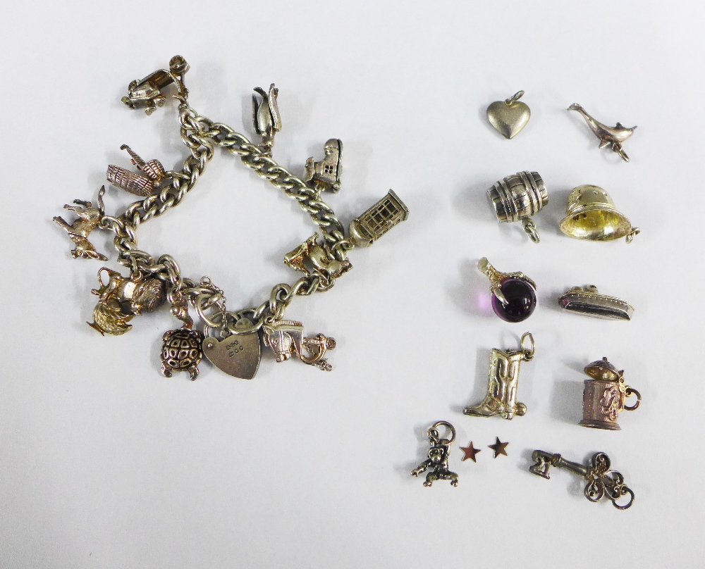 Silver charm bracelet and a quantity of charms (a lot)