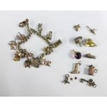 Silver charm bracelet and a quantity of charms (a lot)