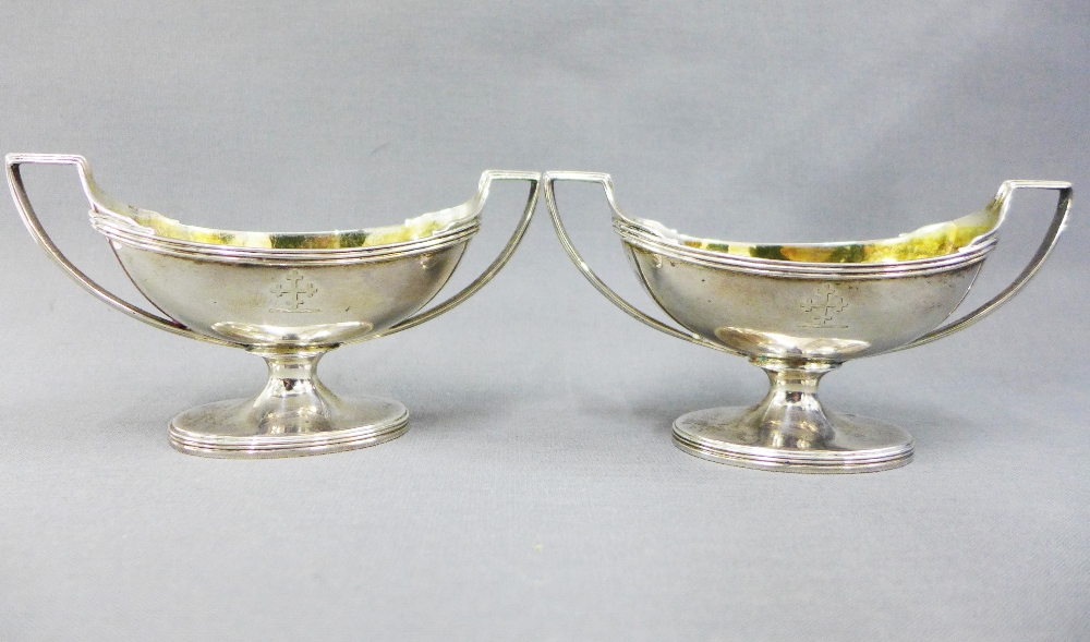 A pair of George III silver gilt salts, John Emes, London 1804, of twin handled navette shape, on