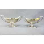 A pair of George III silver gilt salts, John Emes, London 1804, of twin handled navette shape, on