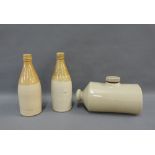 Two stoneware bottles and a foot warming flask (3)