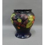 Moorcroft pottery baluster vase in the clematis pattern with a cobalt blue ground, facsimile