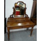 Victorian mahogany dressing table, the mirror with a shaped top rail over three jewel drawers with