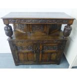Oak court cupboard with fruit and vine carving, with a pair of cupboards to the base, 123 x 118cm