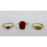 18ct gold three stone diamond cross over ring, a 9ct gold gemset ring and a 9ct gold plaque ring (3)