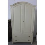 Leporello cream wardrobe with arched top over a pair of doors and two base drawers, 196 x 108cm