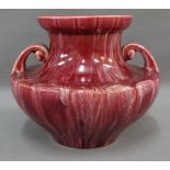 Pilkingtons Royal Lancastrian squat vase with twin scrolling handles and sang de boeuf glaze,