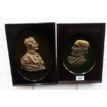 Pair of mahogany framed brass plaques, 20 x 27cm overall (2)