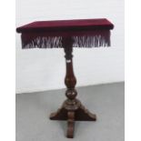 19th century pedestal table with a velvet upholstered rectangular top on a tall baluster column